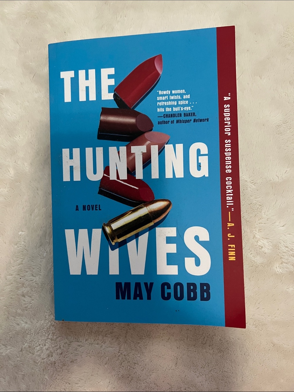 The Hunting Wives by — Blue Cover Paperback